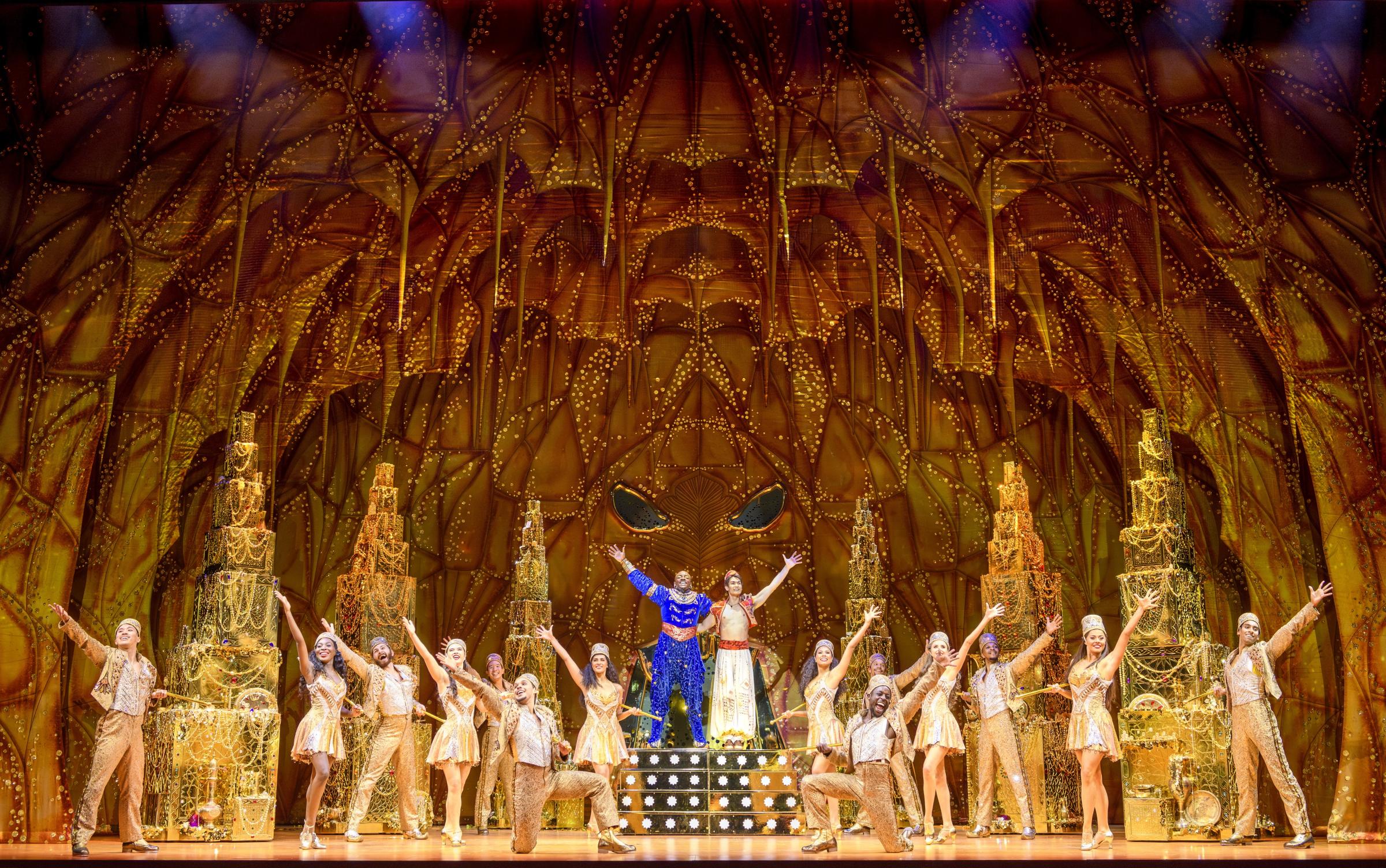 Gavin Adam, Aladdin, and, Yeukayi Ushe as the Genie with the cast of Aladdin the Musical (Picture: Deen Van Meer)